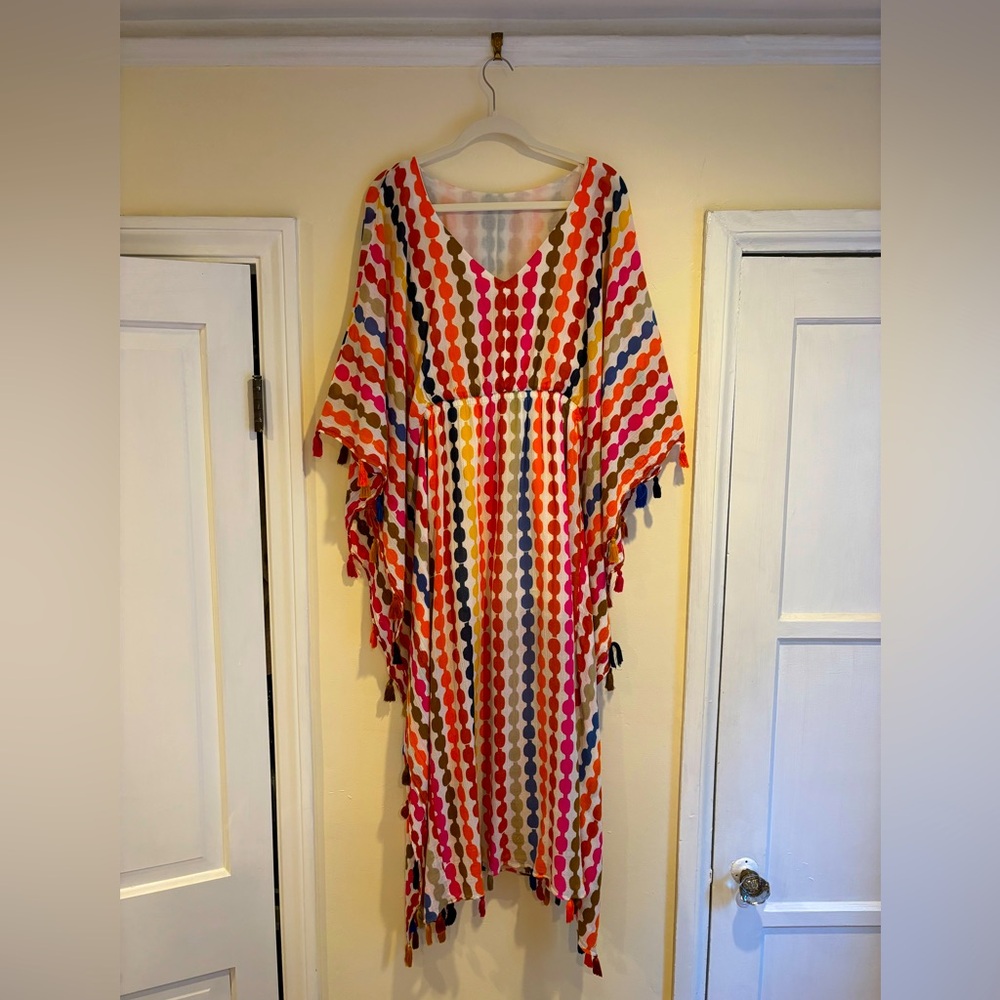 Vibrant Palm Springs Trina Turk caftan with tassels at sleeves and hem.
